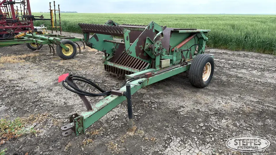Crown rotary rock picker