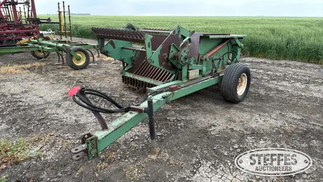 Crown rotary rock picker