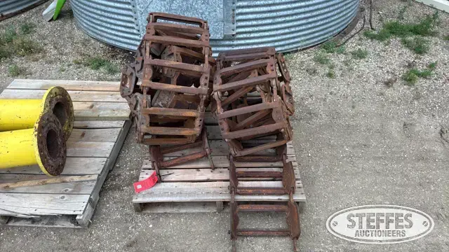 (2) John Deere 147E steel tracks