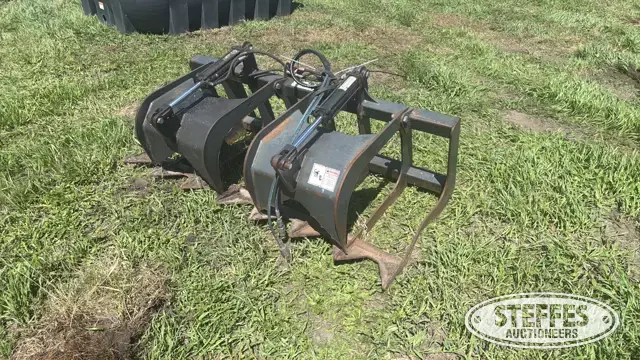 Stout skid steer rock grapple bucket
