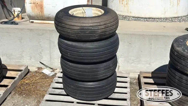 (4) 9.5L-14 tires