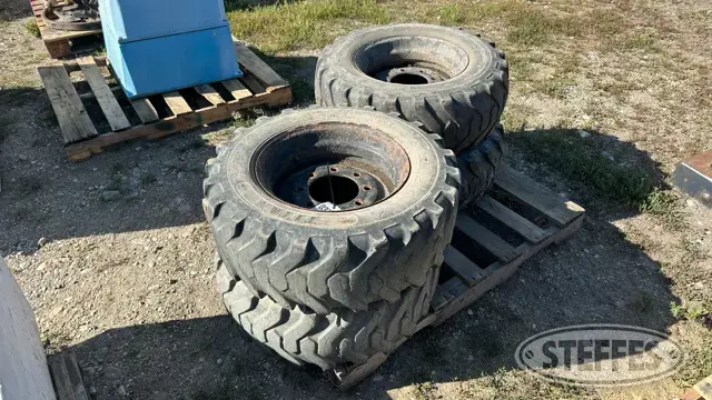 (4) Titan 10-16.5 skid steer tires