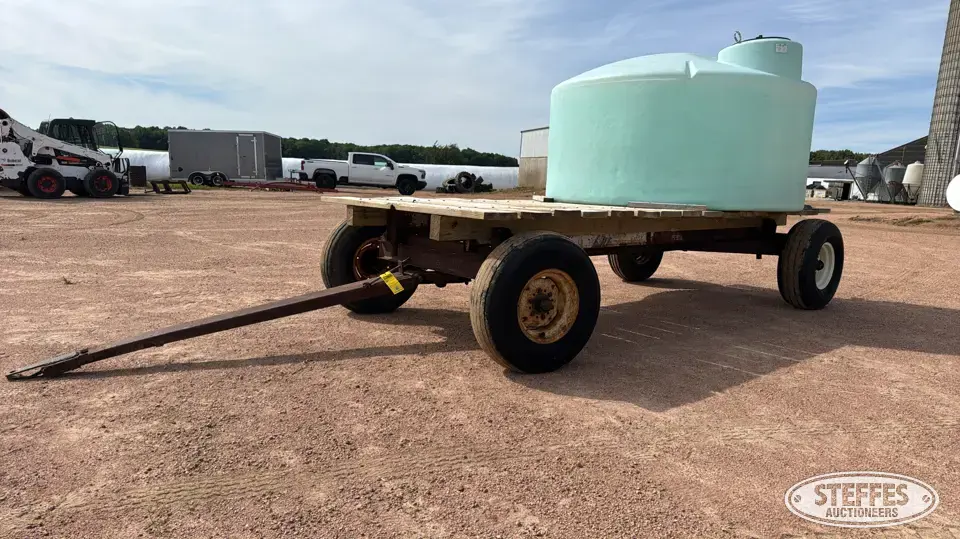 Flat rack w/1,000 gal. poly tank Bale Transportation