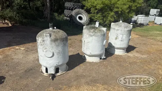 (3) 100 gal.+/- fiberglass storage tanks