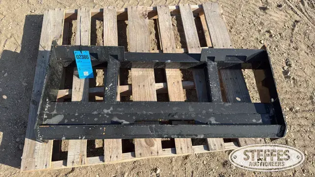 Skid steer pallet fork frame