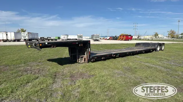 1987 Trail King tandem axle extendable double drop trailer