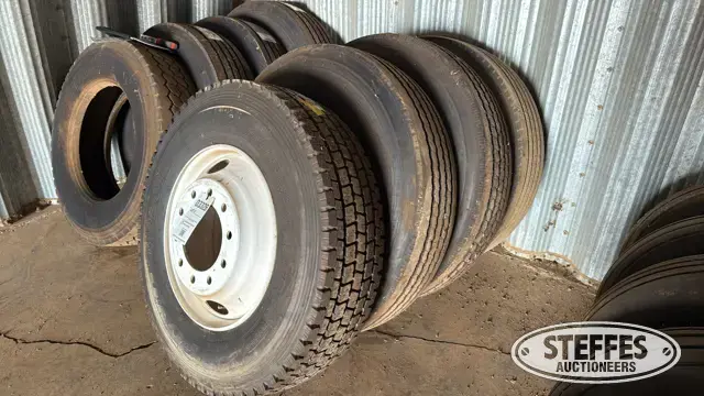 (4) Truck tires on wheels