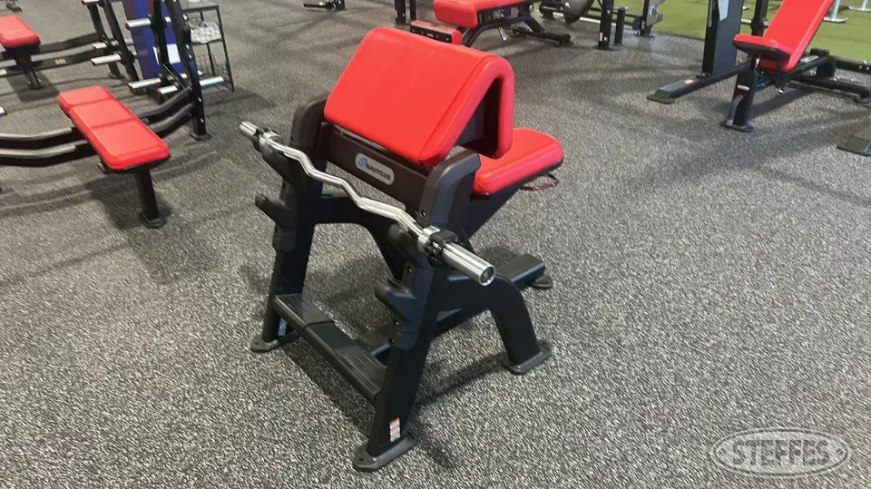 Nautilus preacher curl bench w/ EZ bar Personal Property