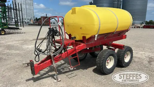 Pull-behind fertilizer trailer