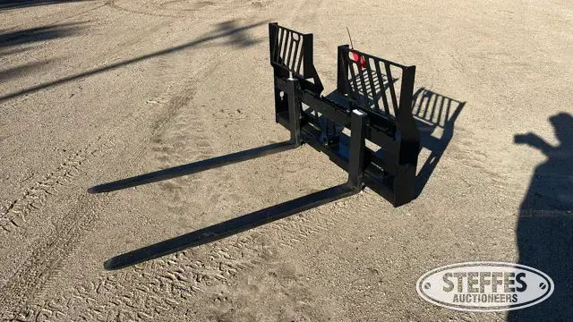 Walk-through skid steer pallet forks