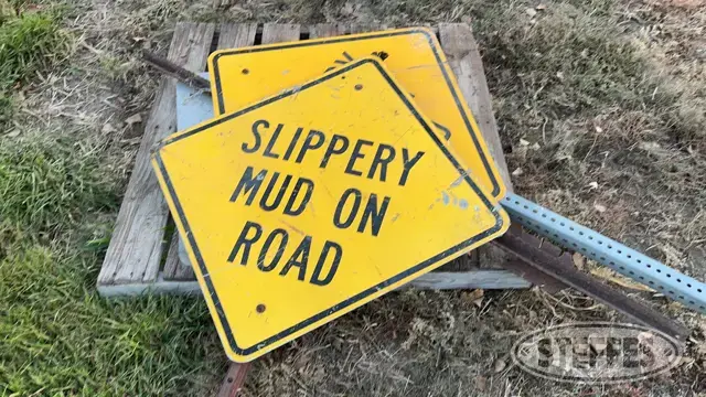 (3) "Slippery Mud On Road" signs